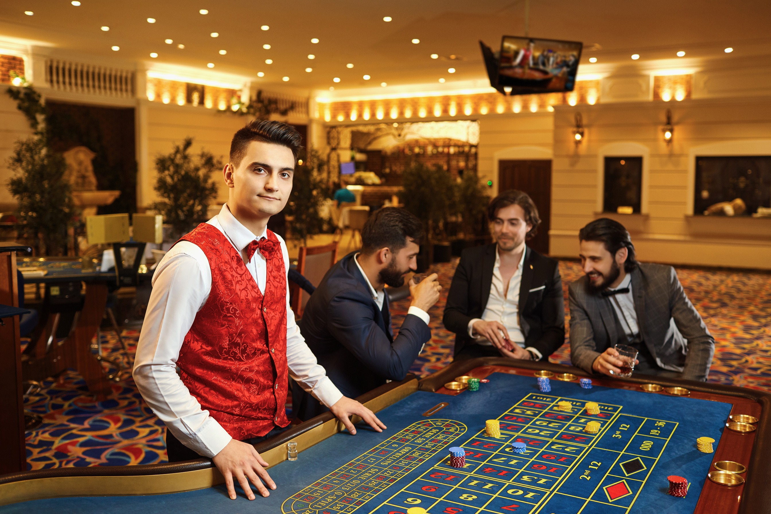 A Croupier Works at a Poker Roulette in a Casino